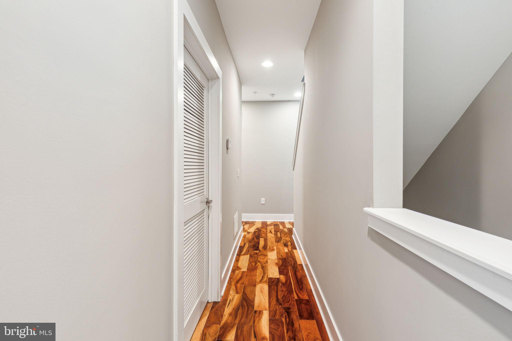 832 North 3rd Street, Unit 7 Philadelphia, PA 19123 - Photo 25 of 52 a view of a hallway with wooden floor and a bathroom