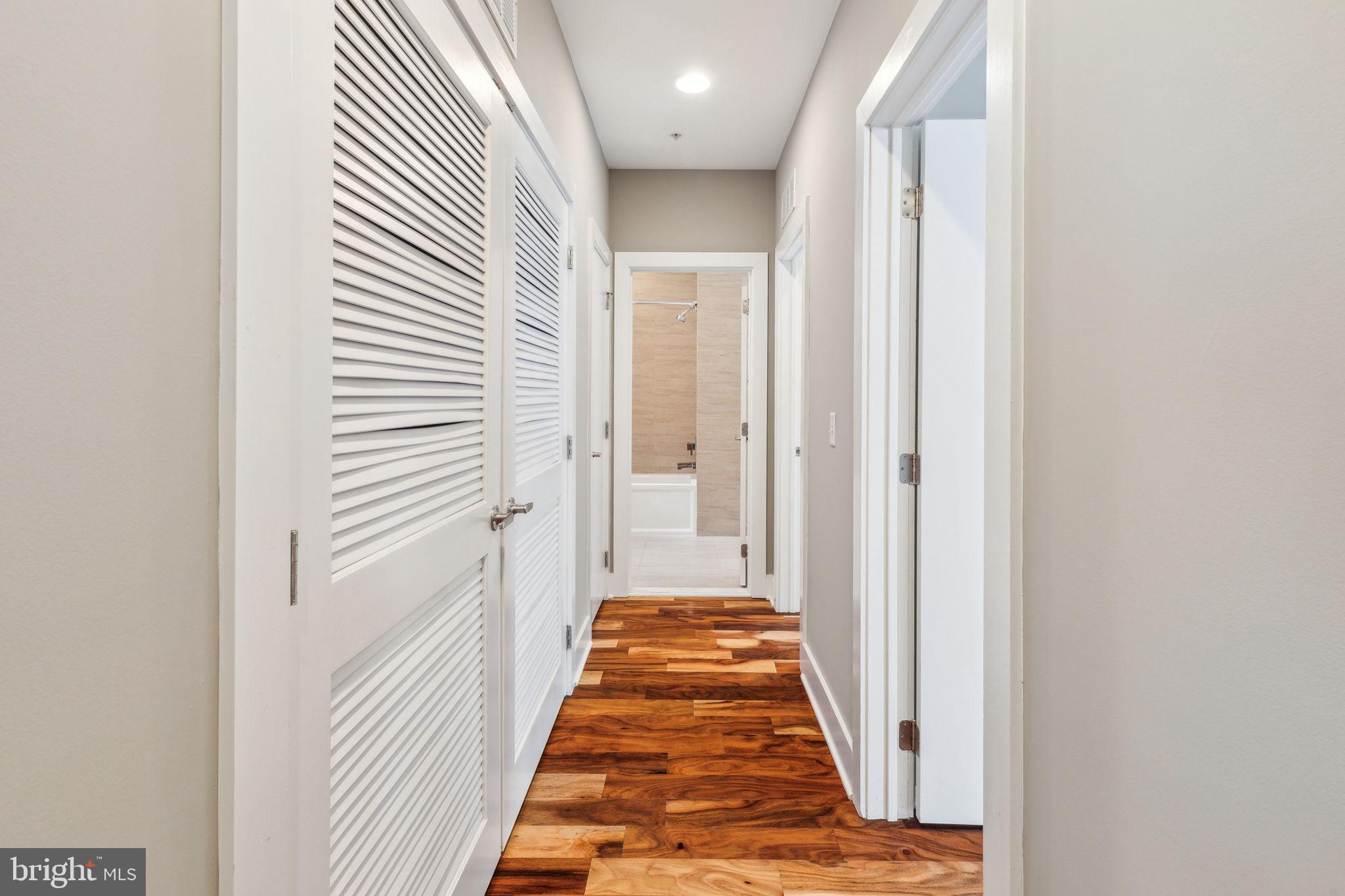 832 North 3rd Street, Unit 7 Philadelphia, PA 19123 - Photo 27 of 52 a view of a hallway with wooden floor and a bathroom