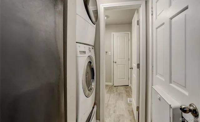 a view of a hallway with washer and dryer