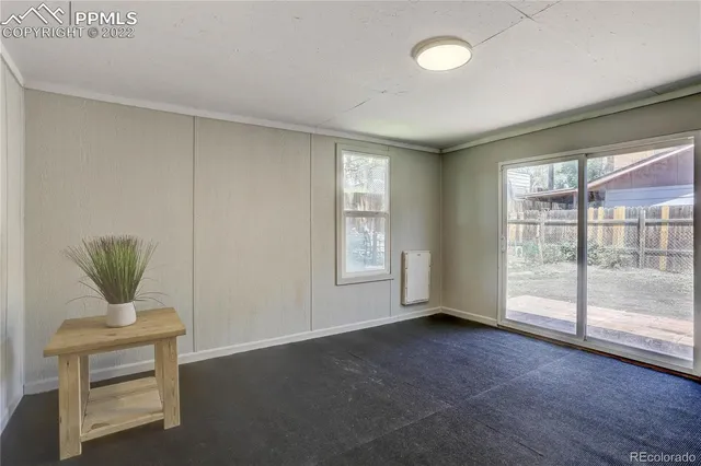 a view of an empty room with a window