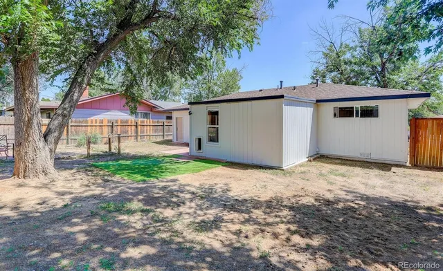 a house with trees in front of it
