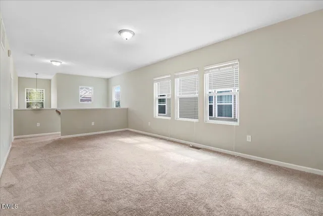 a kitchen with granite countertop wooden cabinets and stainless steel appliances