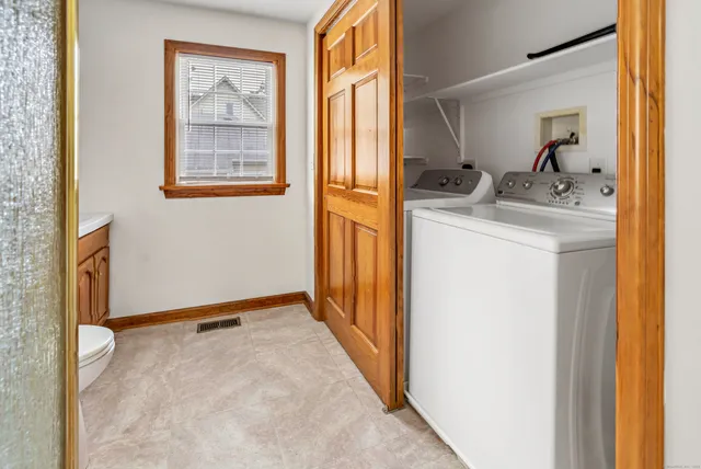 a view of hallway with livingroom and furniture
