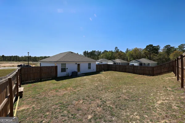 a house view with a garden space