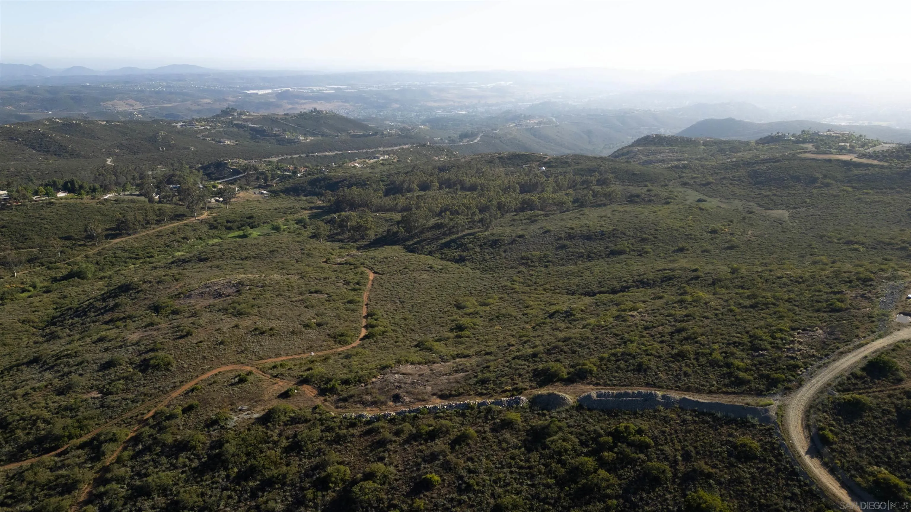 15095 Misty Meadow Road Poway, CA 92064 - Photo 8 of 15 a view of a city with lush green forest