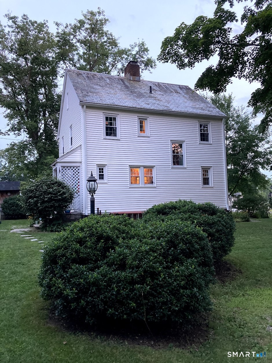 19 Church Street Plainfield, CT 06374 - Photo 1 of 39 a front view of a house with a yard