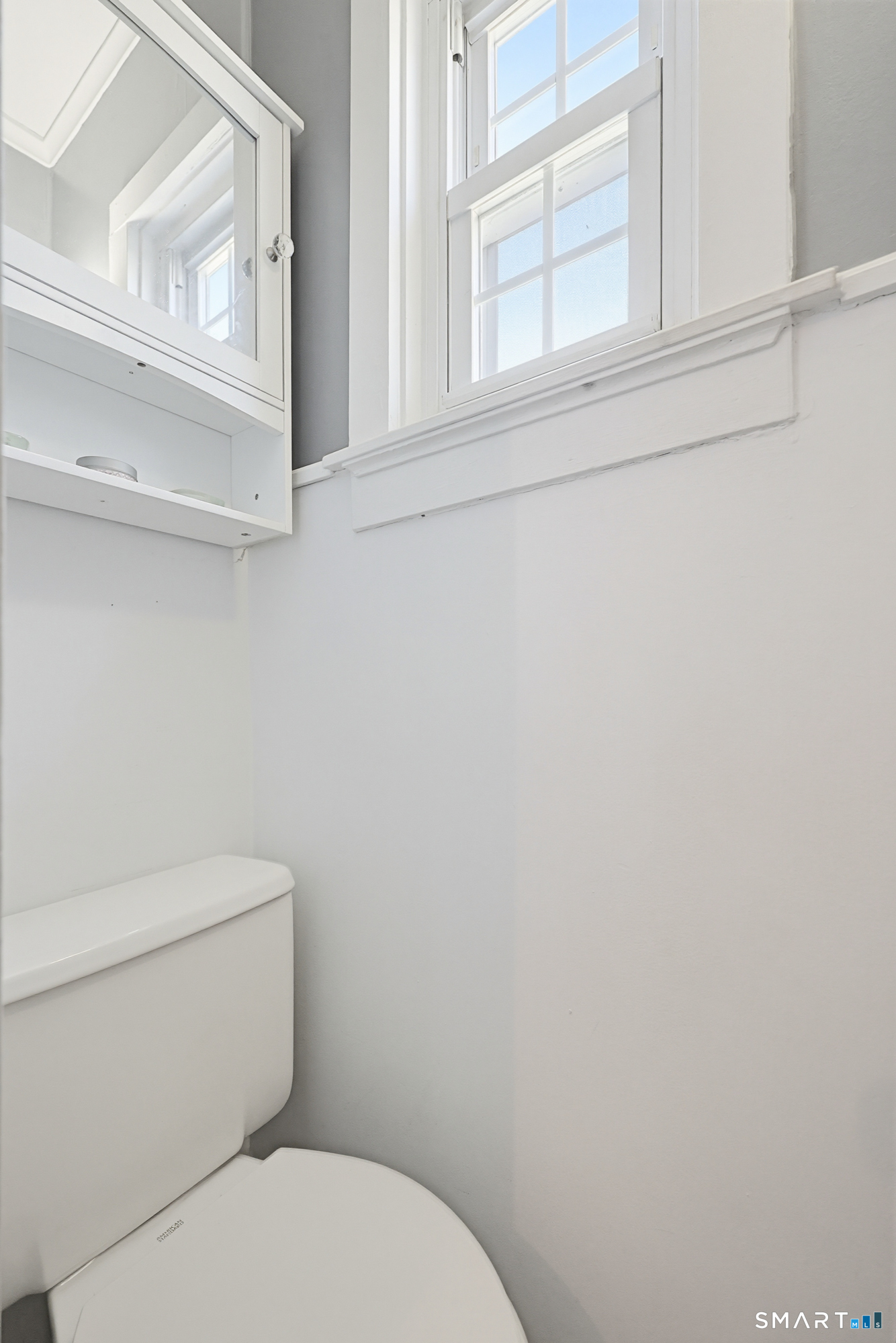 19 Church Street Plainfield, CT 06374 - Photo 17 of 39 a white toilet sitting next to a window