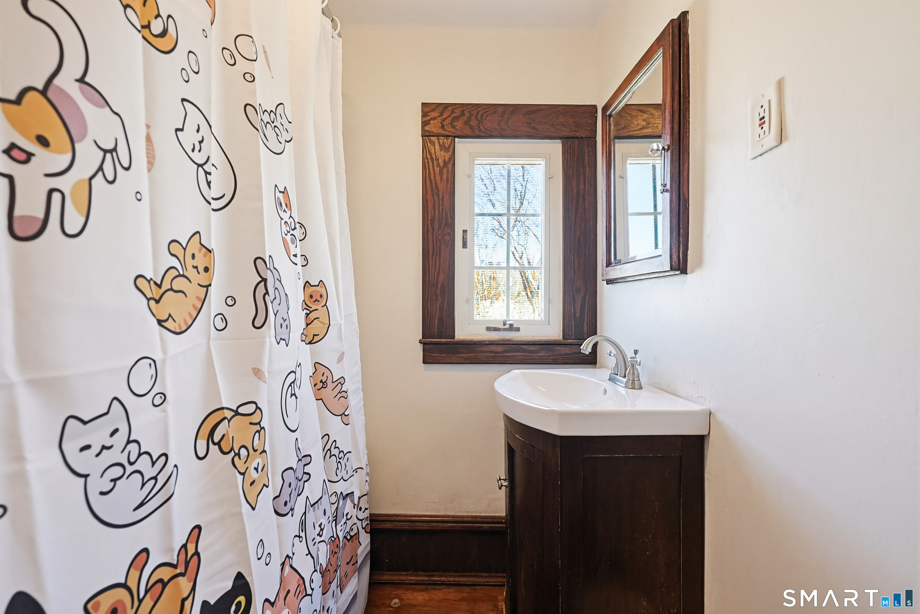 19 Church Street Plainfield, CT 06374 - Photo 21 of 39 a bathroom with a sink and a mirror