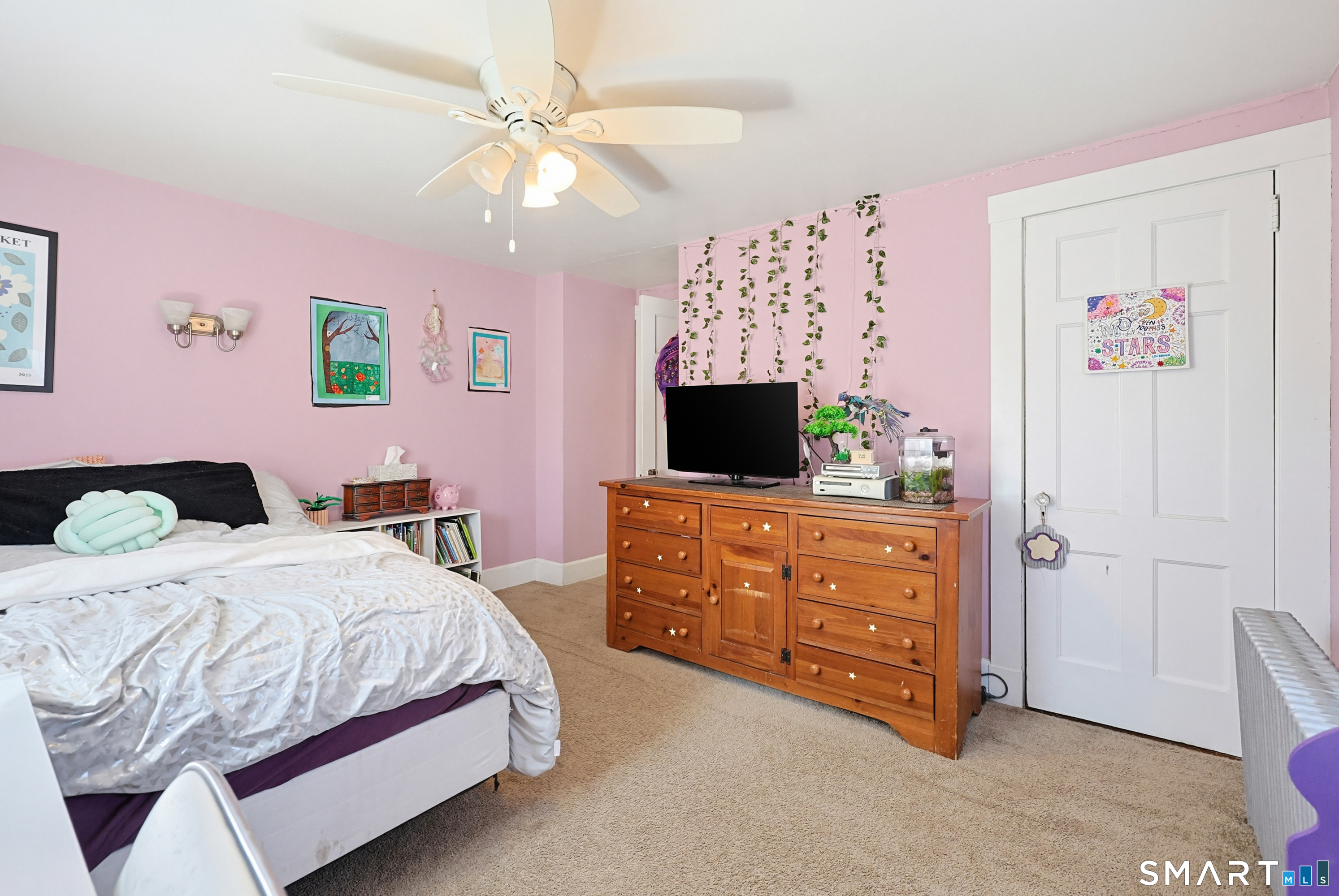 19 Church Street Plainfield, CT 06374 - Photo 24 of 39 a bedroom with a bed and a flat screen tv