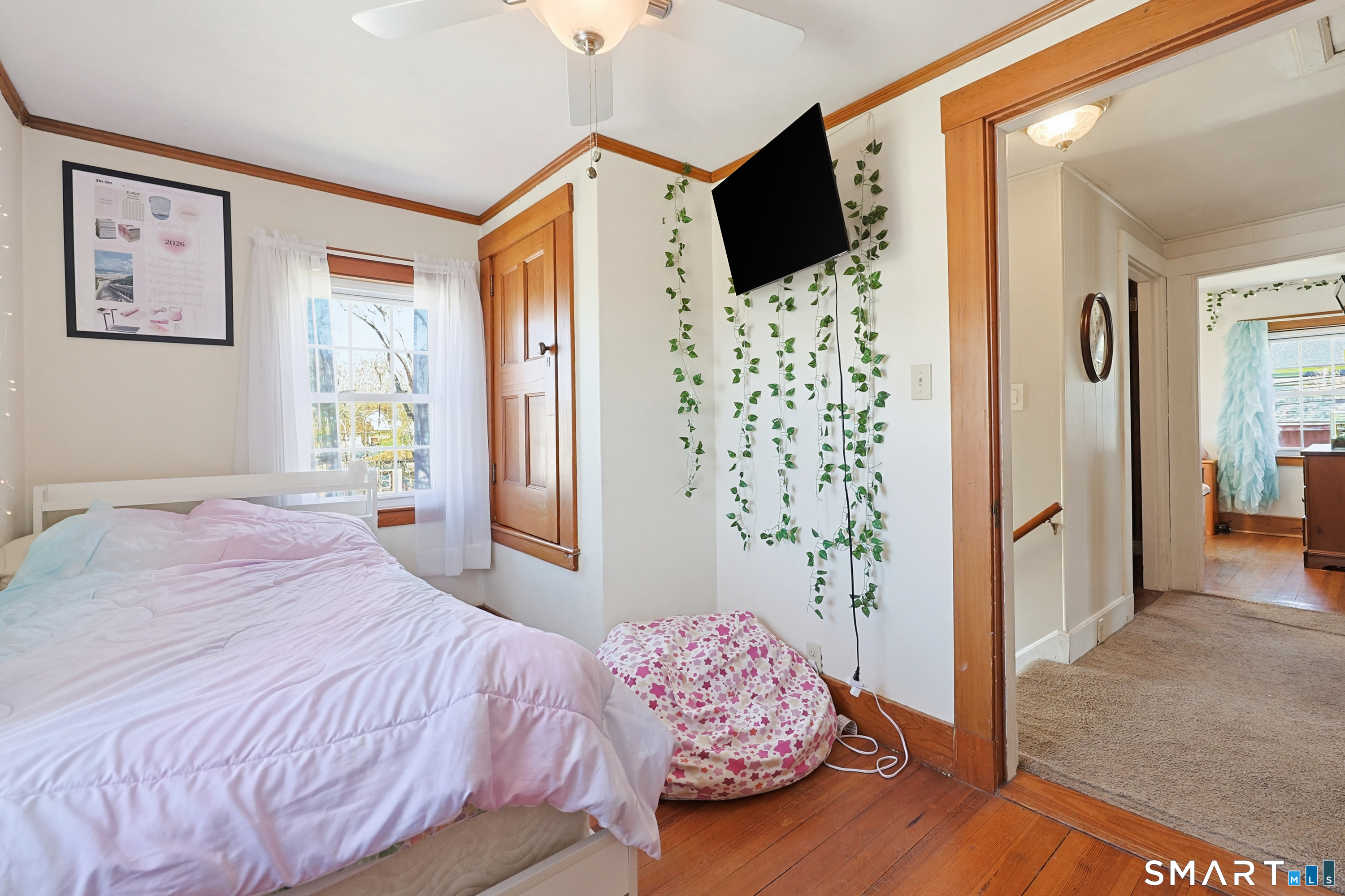 19 Church Street Plainfield, CT 06374 - Photo 27 of 39 a bedroom with a bed and a flat screen tv