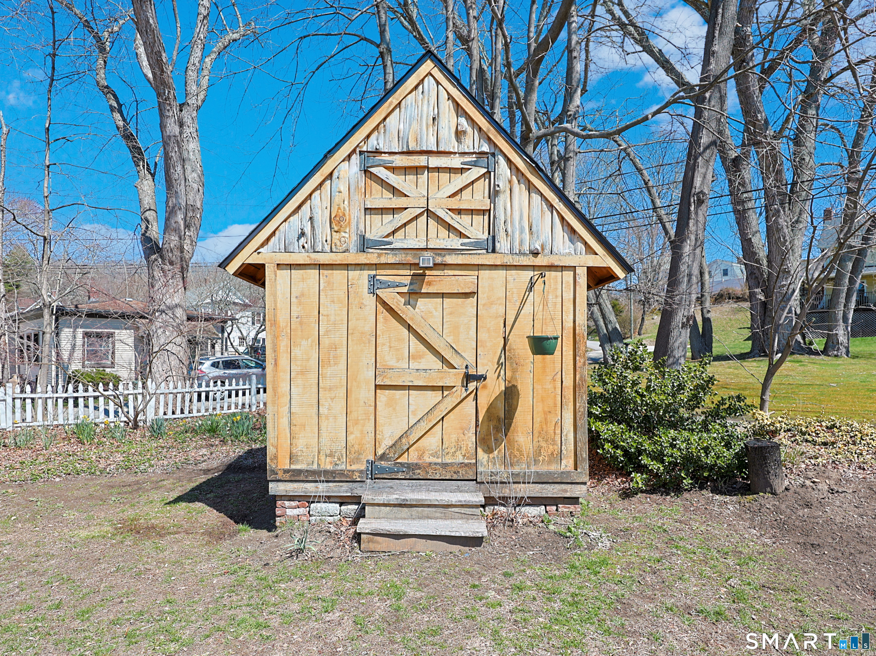 19 Church Street Plainfield, CT 06374 - Photo 38 of 39 a view of wooden house with a small yard and wooden fence
