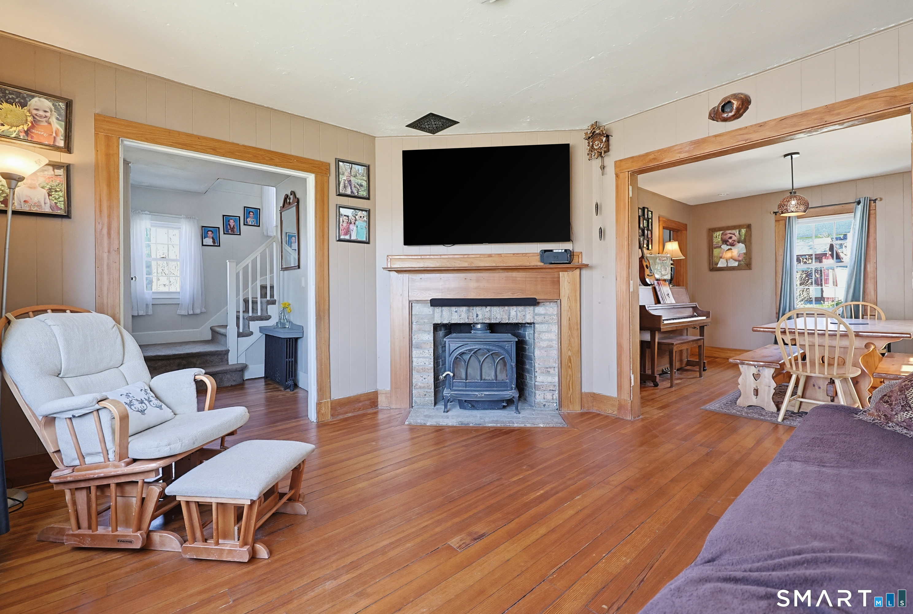 19 Church Street Plainfield, CT 06374 - Photo 5 of 39 a living room with furniture fireplace and flat screen tv