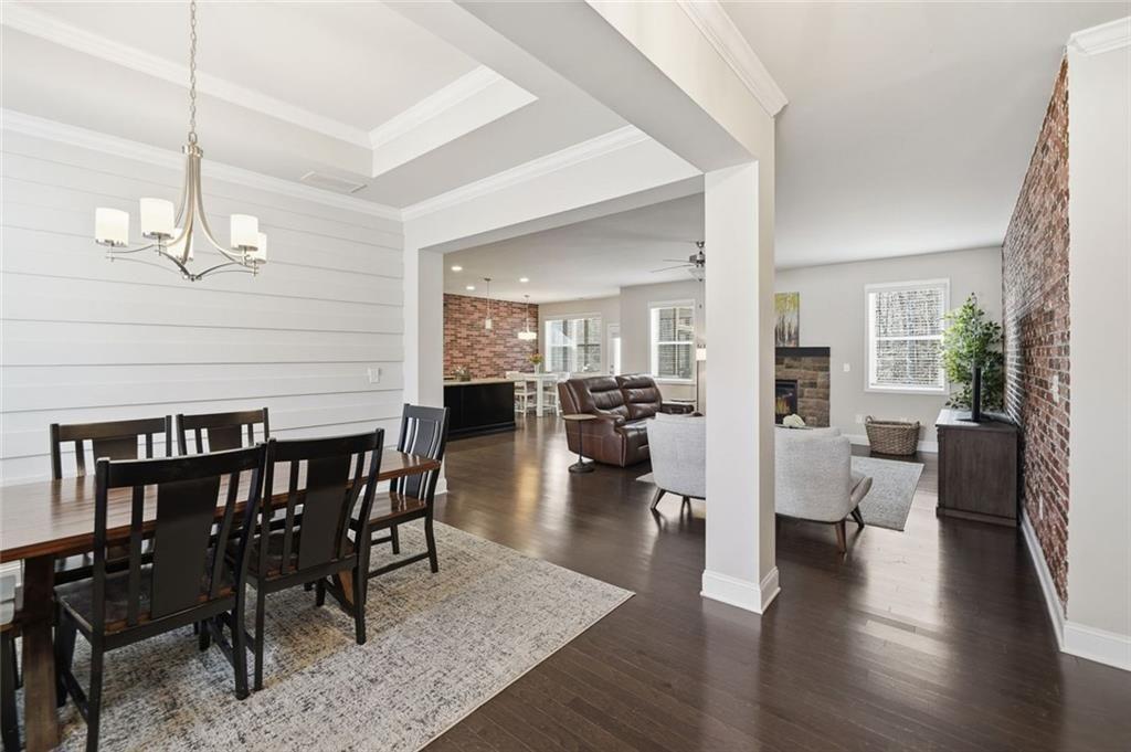 123 Longleaf Drive Canton, GA 30114 - Photo 11 of 39 a view of a dining room and livingroom with furniture wooden floor a chandelier
