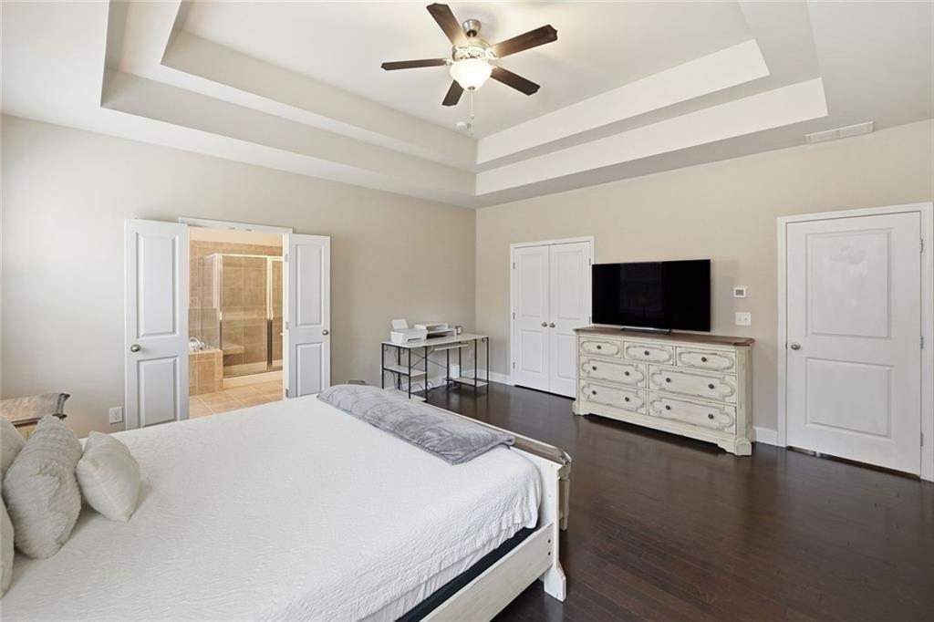 123 Longleaf Drive Canton, GA 30114 - Photo 24 of 39 a bedroom with a bed tv on table and a flat screen tv