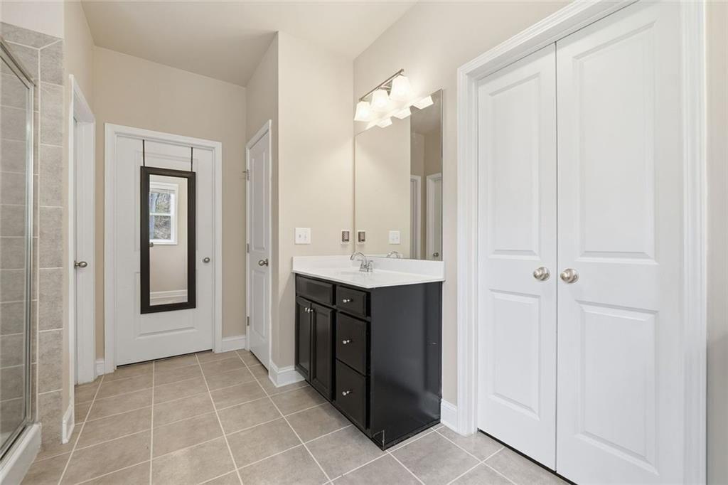 123 Longleaf Drive Canton, GA 30114 - Photo 27 of 39 a bathroom with a sink vanity and a mirror