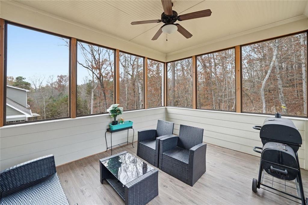 123 Longleaf Drive Canton, GA 30114 - Photo 29 of 39 a living room with furniture and a floor to ceiling window