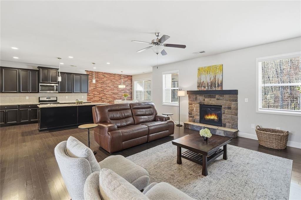 123 Longleaf Drive Canton, GA 30114 - Photo 10 of 39 a living room with furniture and a fireplace
