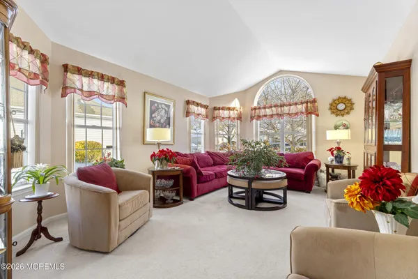 a dining room with furniture and window