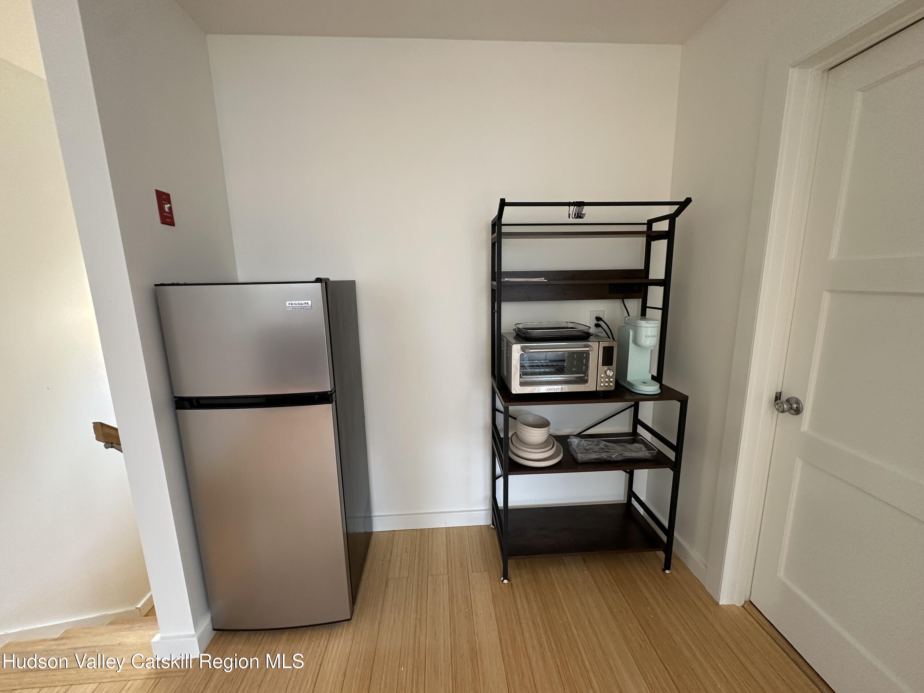 85 Broadview Road, Unit STUDIO Woodstock, NY 12498 - Photo 7 of 10 a view of room with furniture and wooden floor