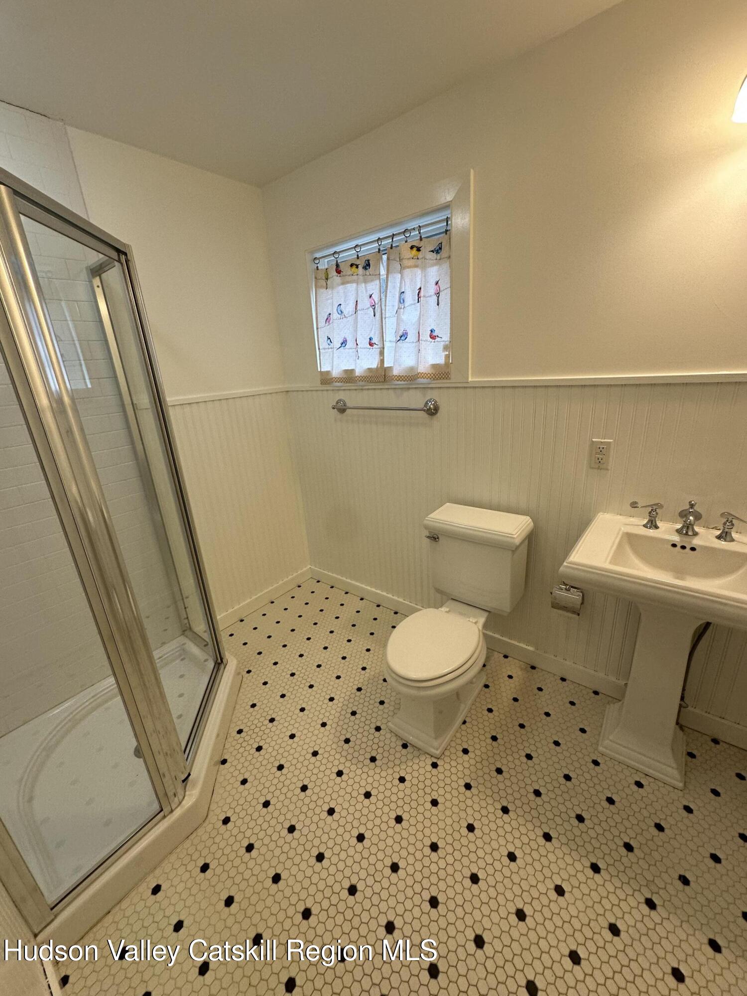 85 Broadview Road, Unit STUDIO Woodstock, NY 12498 - Photo 8 of 10 a white toilet sitting next to a bathroom sink