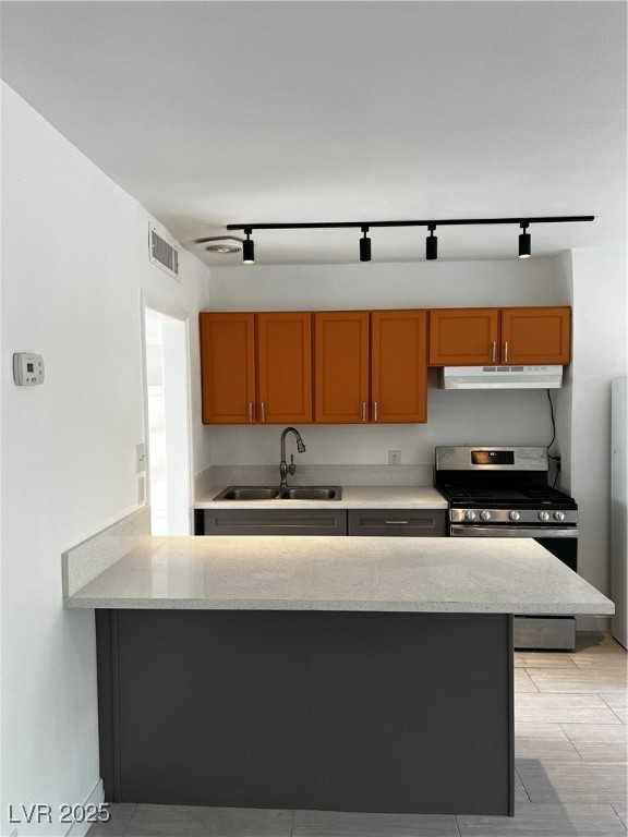 308 West Cincinnati Avenue, Unit 8 Las Vegas, NV 89102 - Photo 5 of 9 Kitchen featuring stove, exhaust hood, a sink, light stone counters, and visible vents