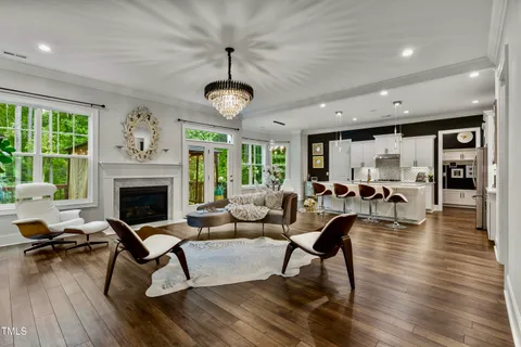 a kitchen with stainless steel appliances granite countertop a sink refrigerator and cabinets