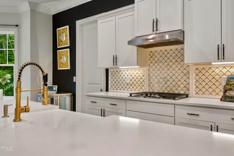 a bathroom with a sink a toilet and shower curtain