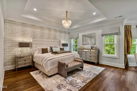 a spacious bathroom with a granite countertop sink a bathtub and shower