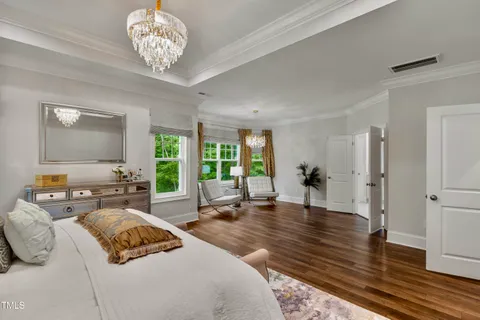 a bedroom with bed and a window