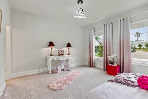 a view of a livingroom with furniture and window