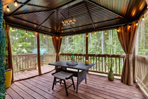 an aerial view of a house with outdoor space and street view