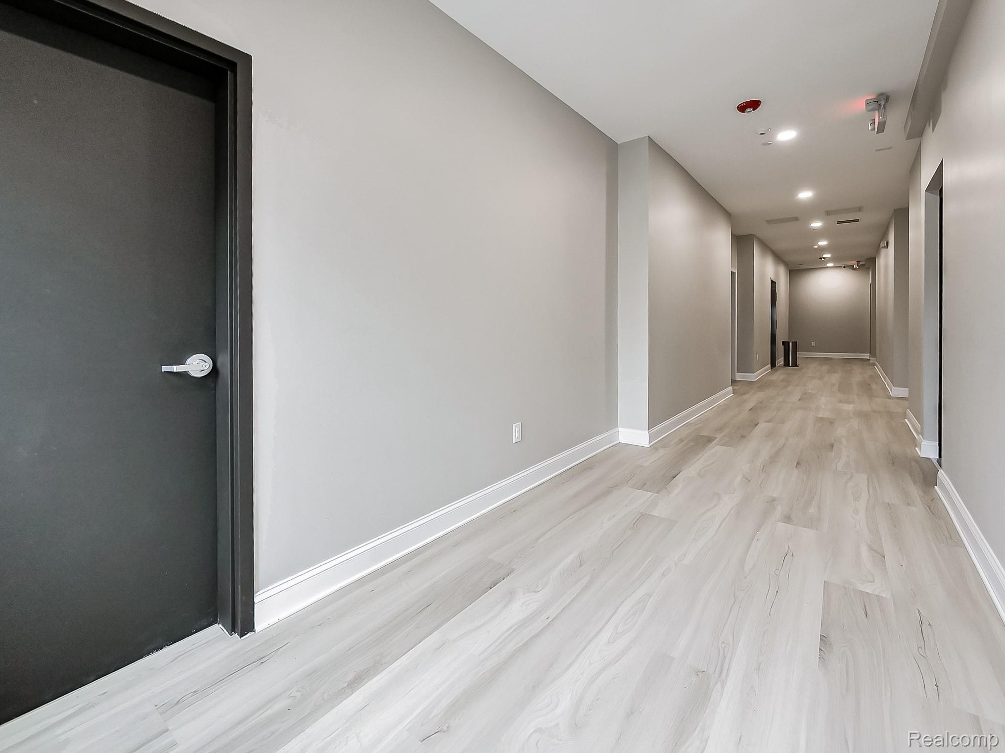 31480 Warren Road, Unit 101 Westland, MI 48185 - Photo 17 of 26 Hallway featuring recessed lighting and light wood-style floors