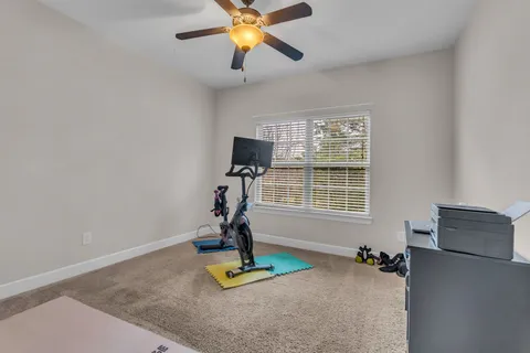a view of a livingroom with furniture and a window