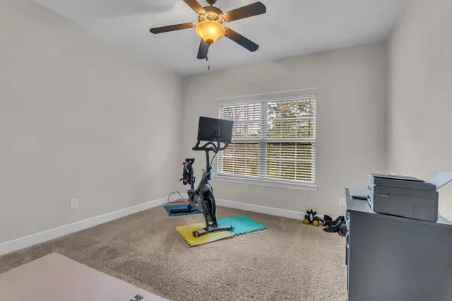 a view of a livingroom with furniture and a window