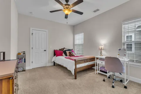 a bedroom with a workspace