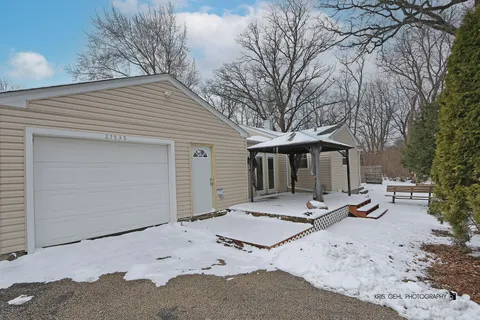 a view of a house with snow in the yard