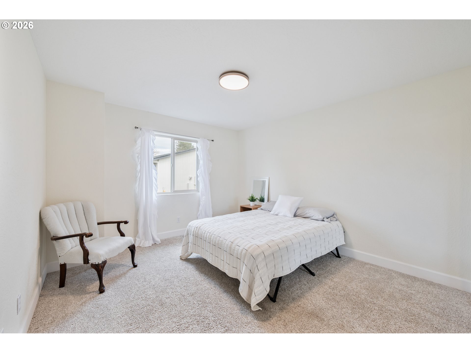1239 Rose Valley Road Kelso, WA 98626 - Photo 21 of 48 a bedroom with a bed and a chair