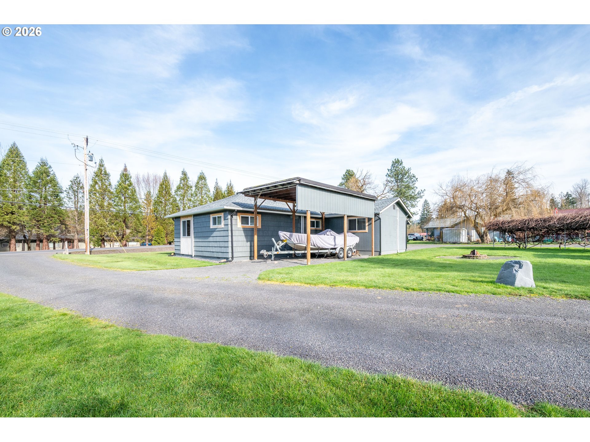 1239 Rose Valley Road Kelso, WA 98626 - Photo 41 of 48 a view of a house with a big yard and large trees