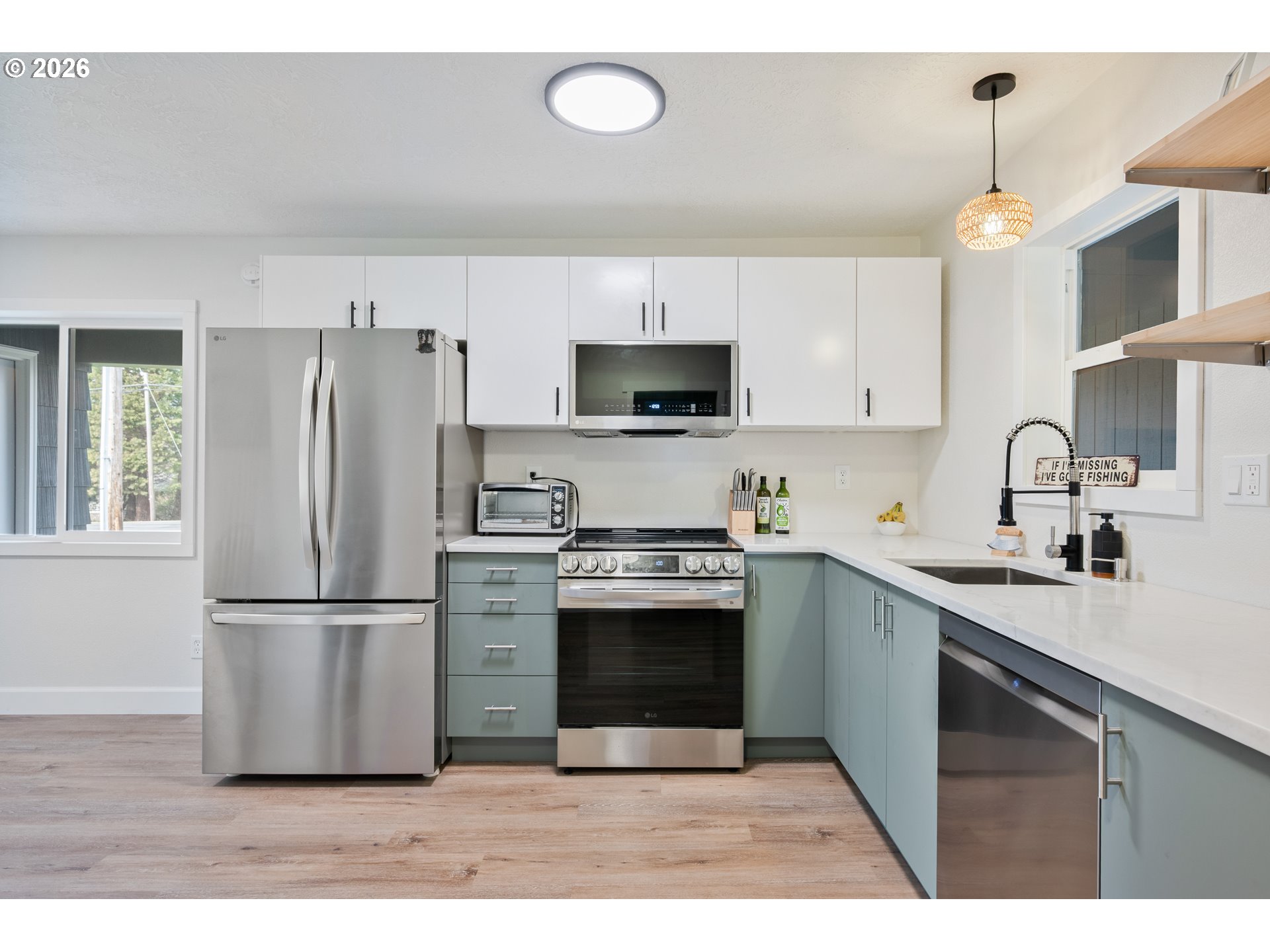 1239 Rose Valley Road Kelso, WA 98626 - Photo 44 of 48 a kitchen with stainless steel appliances granite countertop a refrigerator a stove a sink and a microwave
