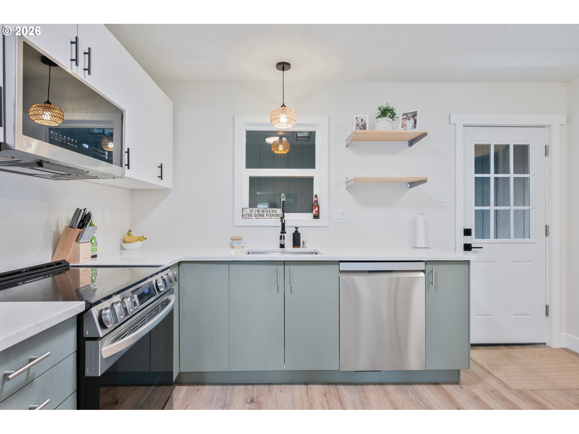 1239 Rose Valley Road Kelso, WA 98626 - Photo 45 of 48 a kitchen with a sink cabinets and window