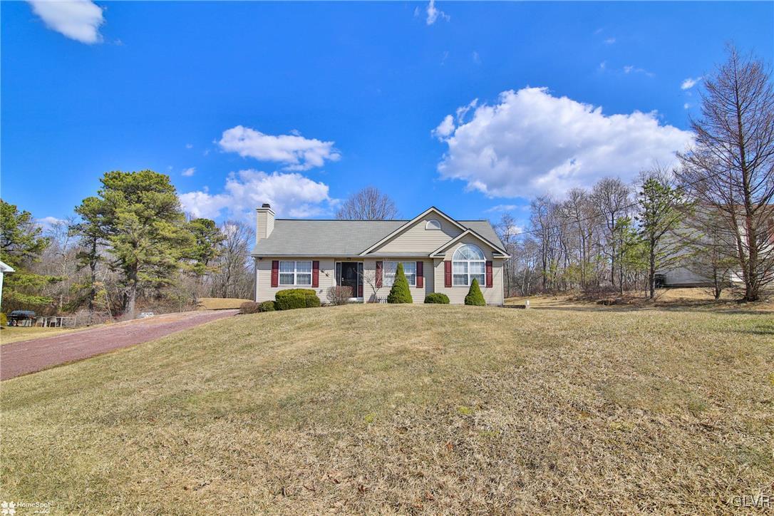 1646 Clover Road Long Pond, PA 18334 - Photo 1 of 31 a front view of a house with a yard and garage