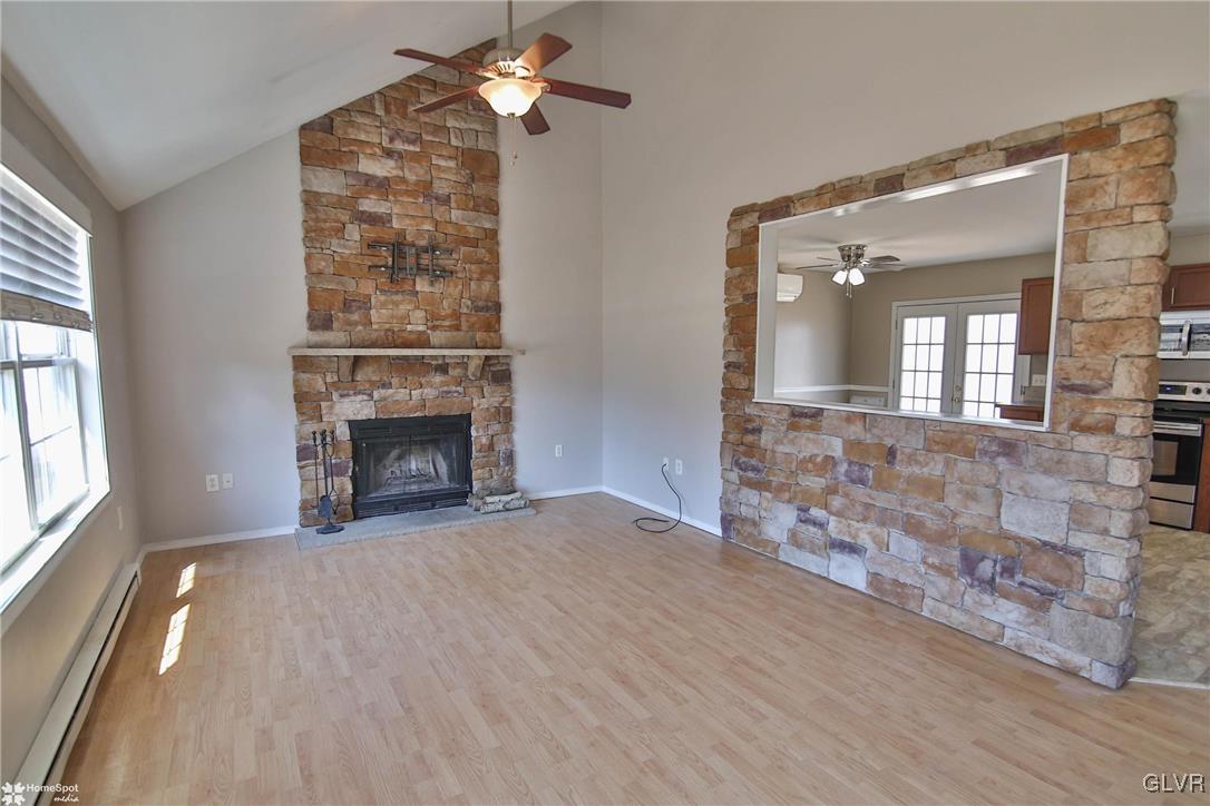 1646 Clover Road Long Pond, PA 18334 - Photo 5 of 31 an empty room with windows and fireplace
