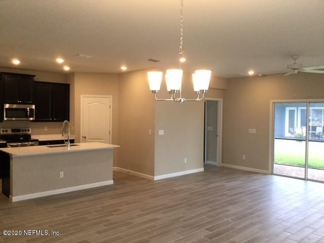 51 Seamount Way St. Augustine, FL 32092 - Photo 4 of 24 a view of a kitchen with a sink and dishwasher a refrigerator with wooden floor