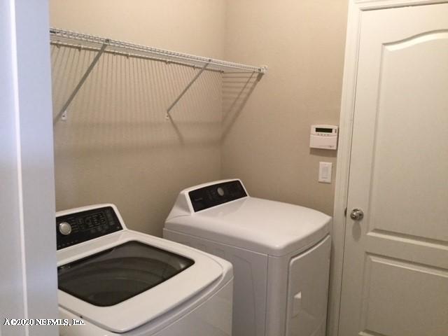 51 Seamount Way St. Augustine, FL 32092 - Photo 5 of 24 a utility room with dryer and washer