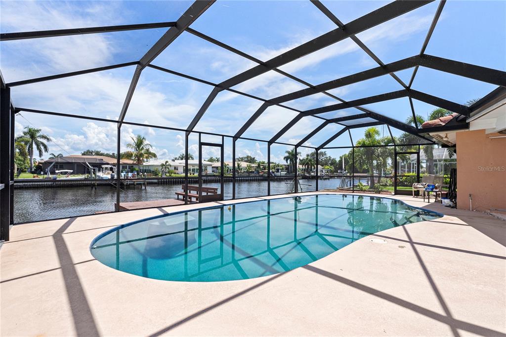 2044 Montana Avenue Northeast St. Petersburg, FL 33703 - Photo 11 of 53 a view of a swimming pool with a porch