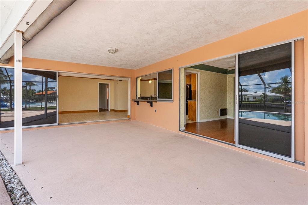 2044 Montana Avenue Northeast St. Petersburg, FL 33703 - Photo 13 of 53 a view of an empty room with glass door and windows