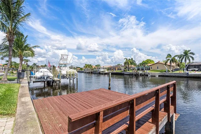 a front view of house with yard and outdoor seating
