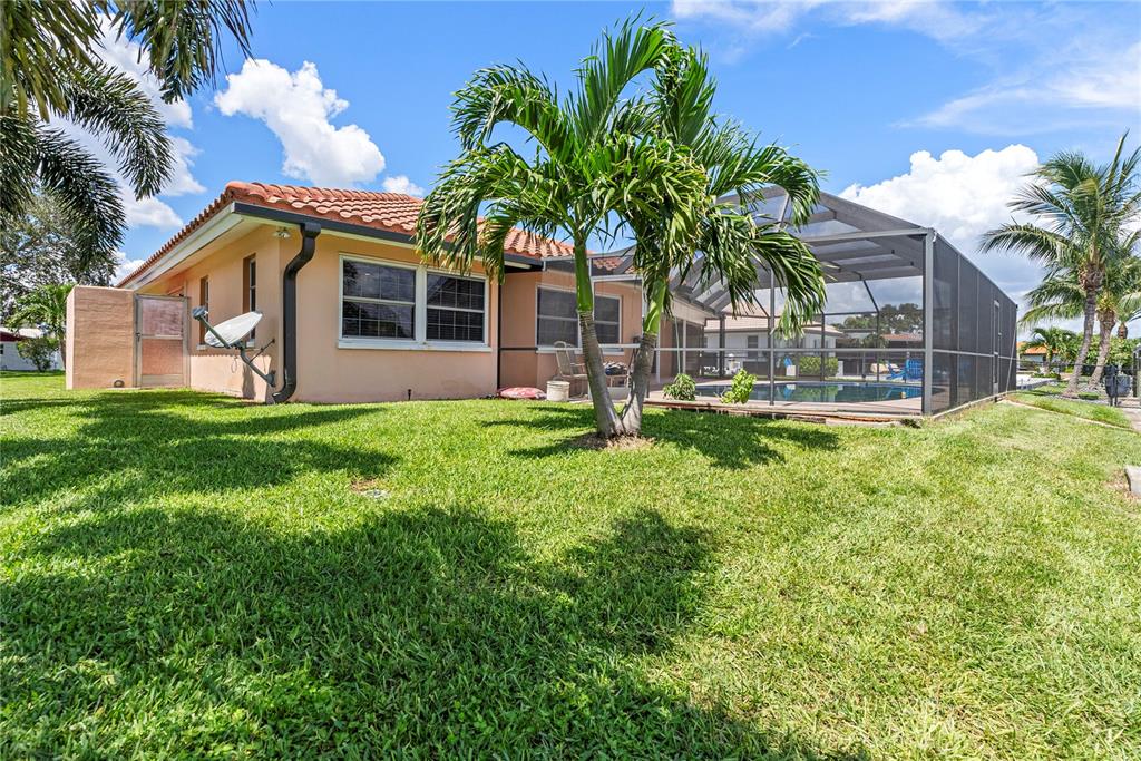 2044 Montana Avenue Northeast St. Petersburg, FL 33703 - Photo 19 of 53 a front view of house with yard and outdoor seating