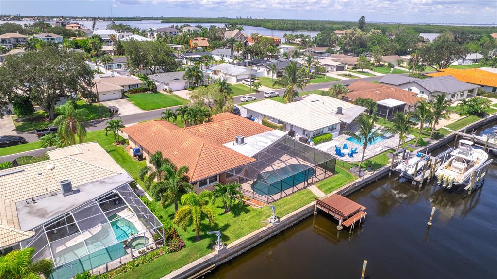 2044 Montana Avenue Northeast St. Petersburg, FL 33703 - Photo 22 of 53 an aerial view of residential houses with outdoor space and swimming pool