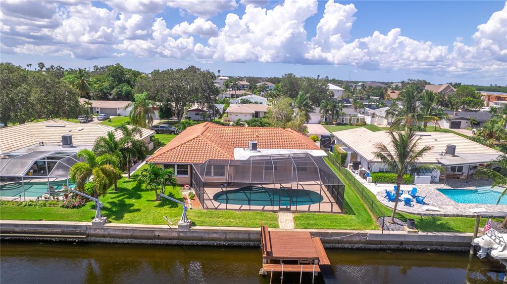 2044 Montana Avenue Northeast St. Petersburg, FL 33703 - Photo 25 of 53 an aerial view of residential houses with swimming pool and outdoor space